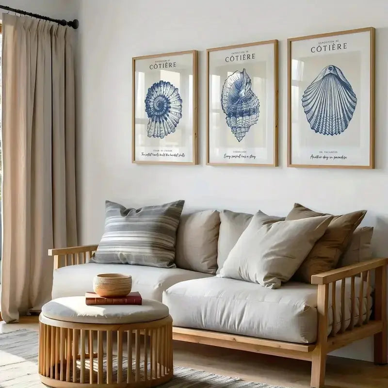 Coastal shell art prints in light wood frames, perfect for beach-themed home decor and gifting