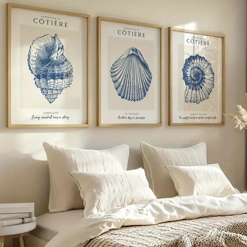 Coastal wall art with blue seashell prints, perfect for beach-themed bedroom decor and home styling.