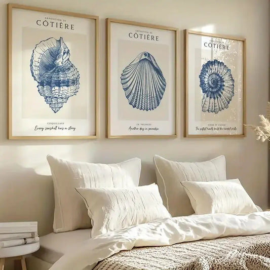 Coastal wall art with blue seashell prints, perfect for beach-themed bedroom decor and home styling.