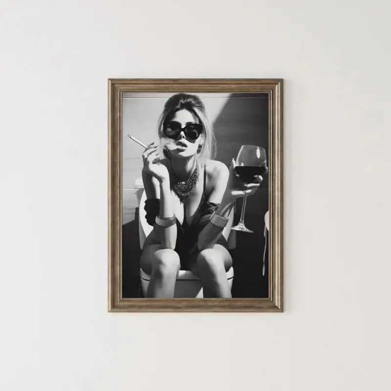 Black and white art print of stylish woman with wine glass and cigarette, framed wall decor